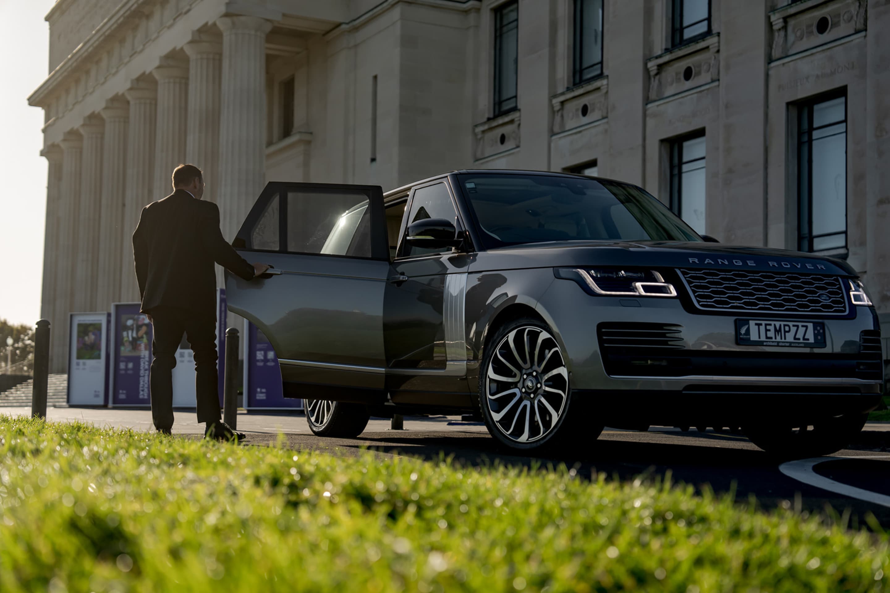Close protection guard opening car door